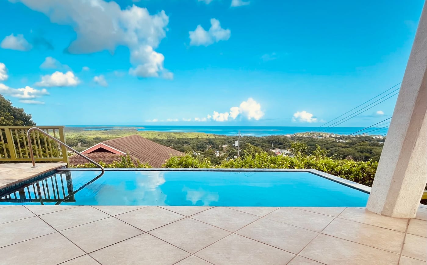Sugar Hill Villa infinity pool terrace with Caribbean Sea views, Tobago